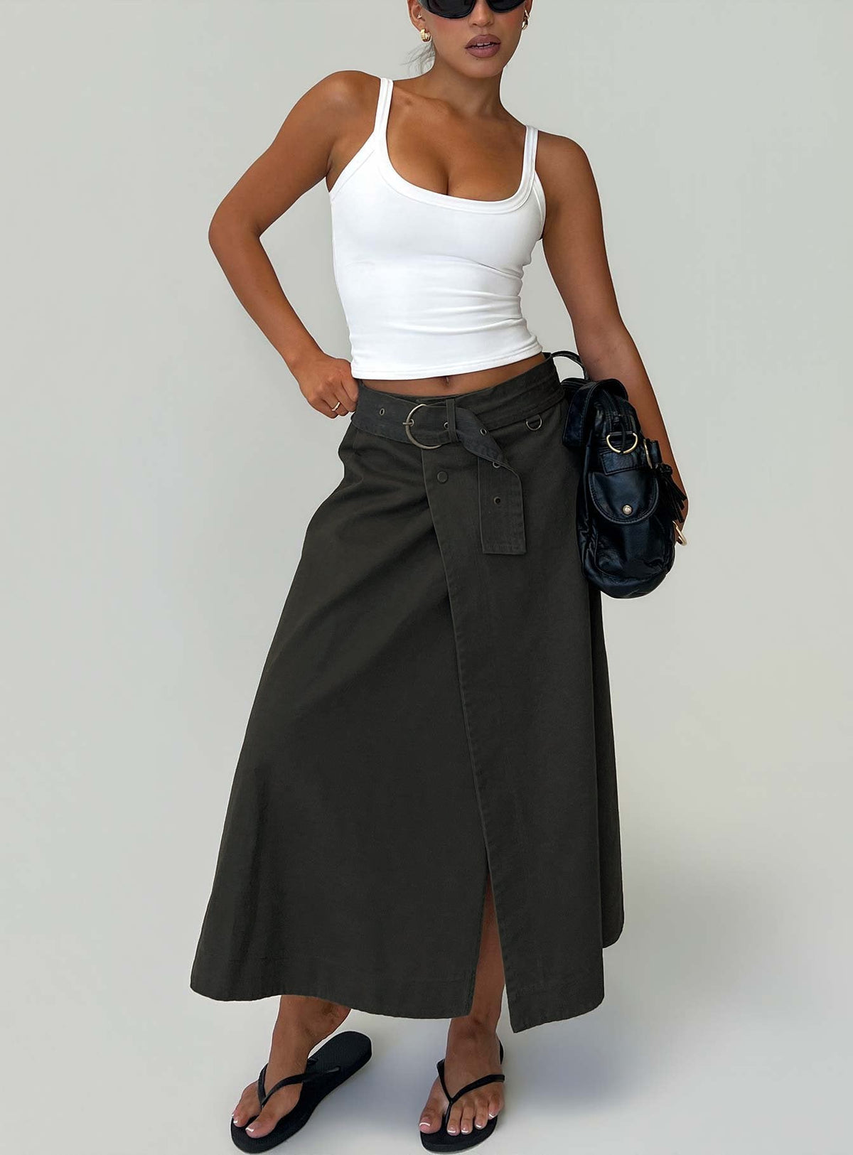 Showcasing the True Visions Belted Maxi Skirt Charcoal womens-skirts in dark olive green maxi length front view of model wearing Princess Polly