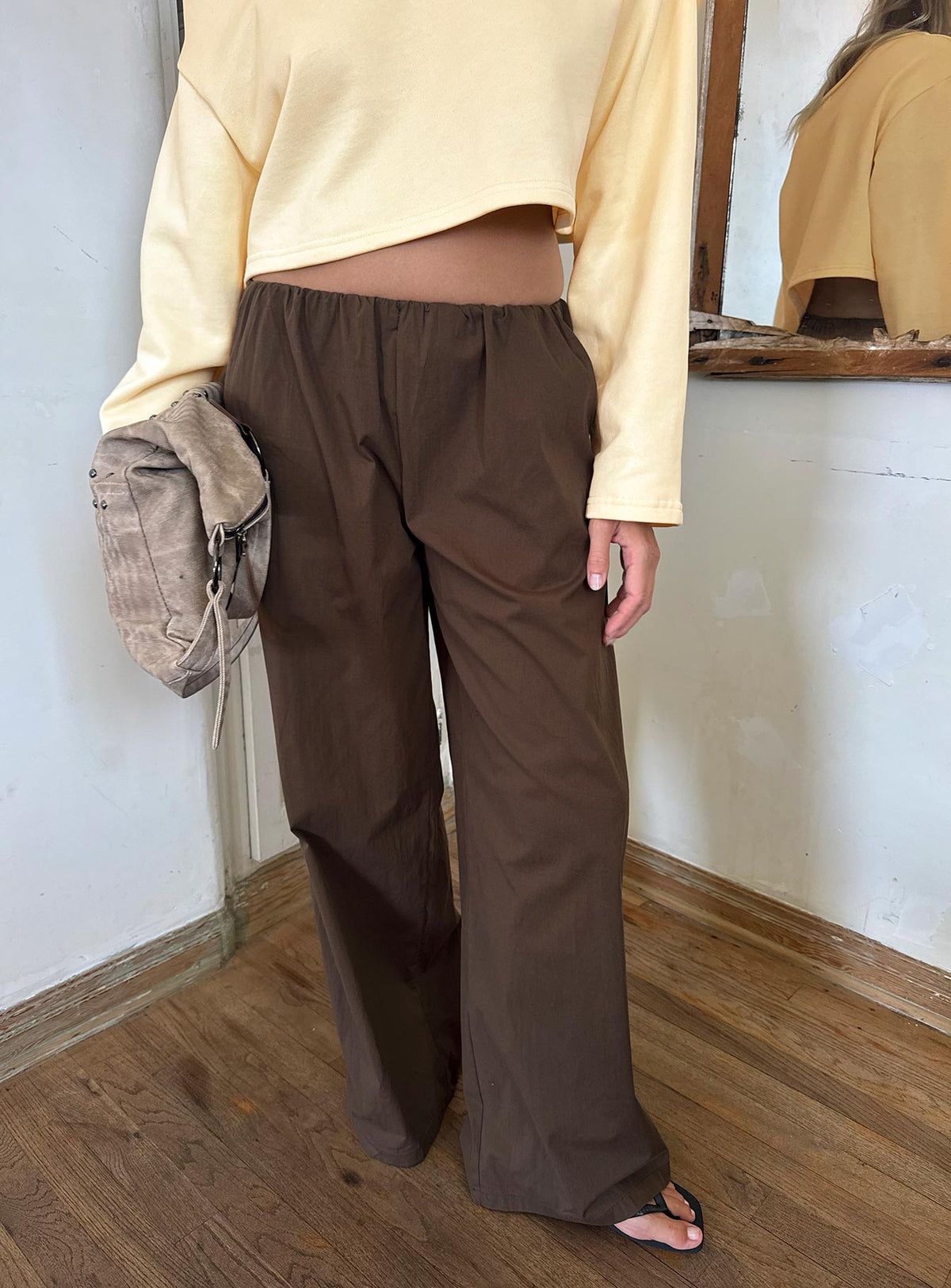Featuring the Lunea Concealed Waistband Pants Brown in womens-regular-pants with mid-rise styling front view of model wearing Princess Polly
