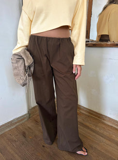 Featuring the Lunea Concealed Waistband Pants Brown in womens-regular-pants with mid-rise styling front view of model wearing Princess Polly