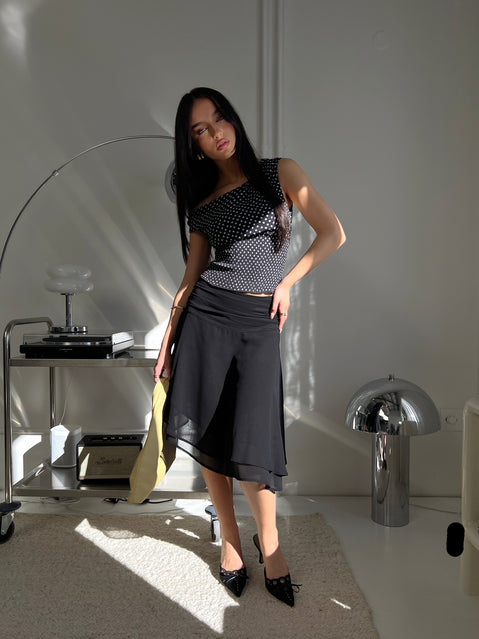 back view of model wearing Princess Polly Evanescence Asymmetrical Midi Skirt Black Midi Skirts 