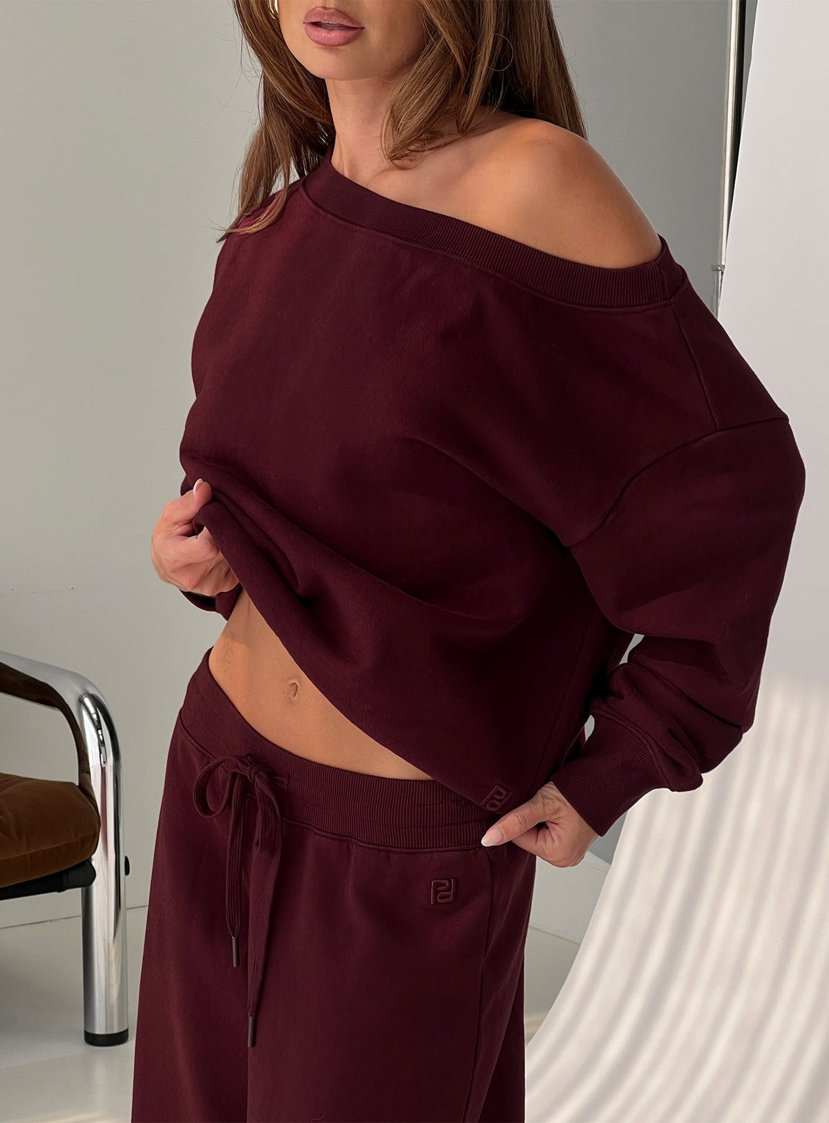 back view of model wearing Princess Polly Wellness Off the Shoulder Jumper Currant 