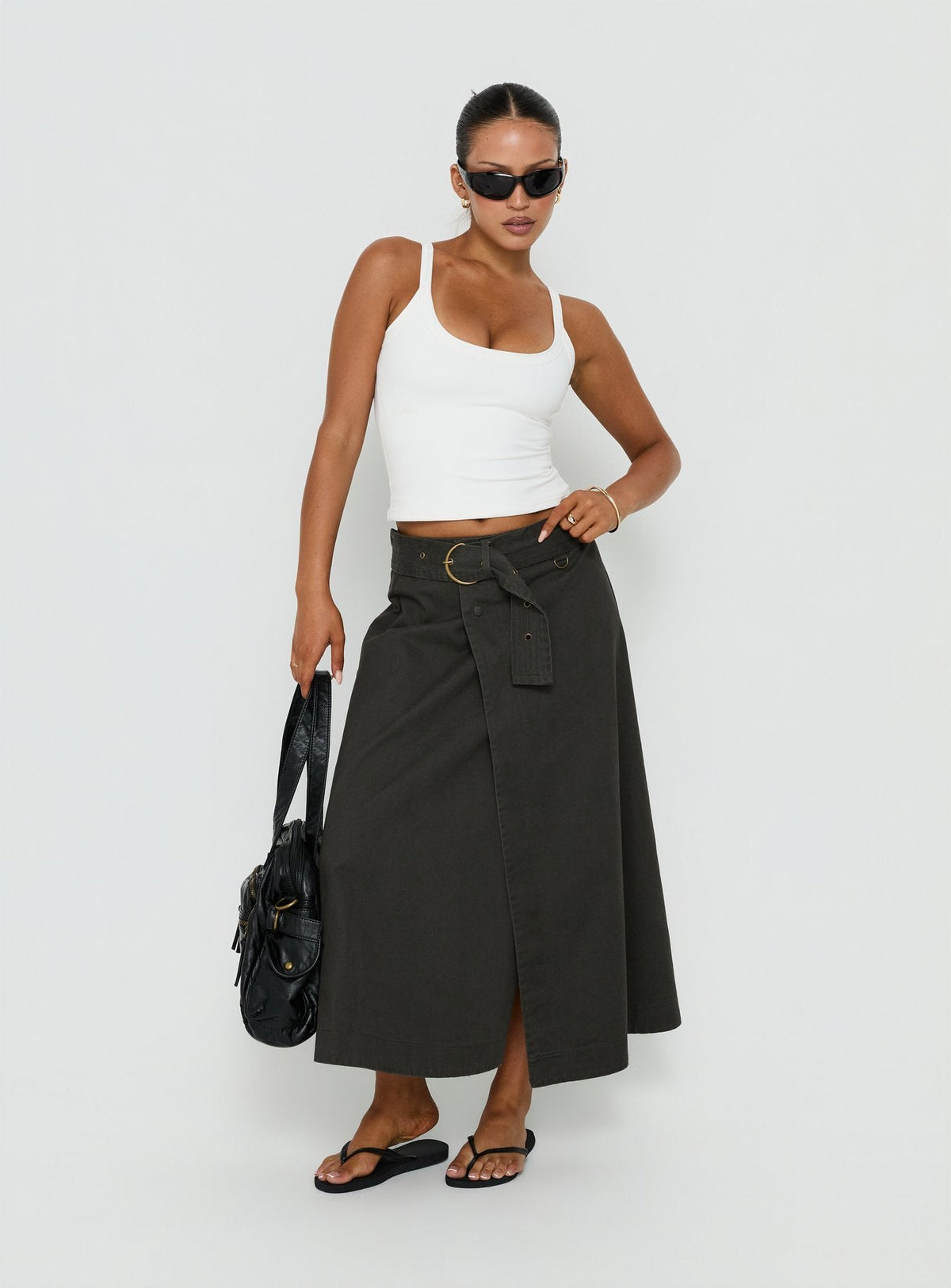 Featuring the True Visions Belted Maxi Skirt Charcoal womens-skirts in dark olive green maxi length side view of model wearing Princess Polly
