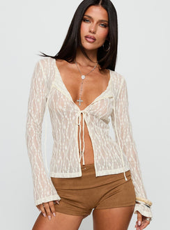 front view of model wearing Princess Polly Open Your Heart Tie Detail Long Sleeve Top Cream Full Sleeves Scoop Neck 