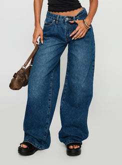 side view of model wearing Princess Polly Duster Oversized Jeans Dark Wash Mid Rise 