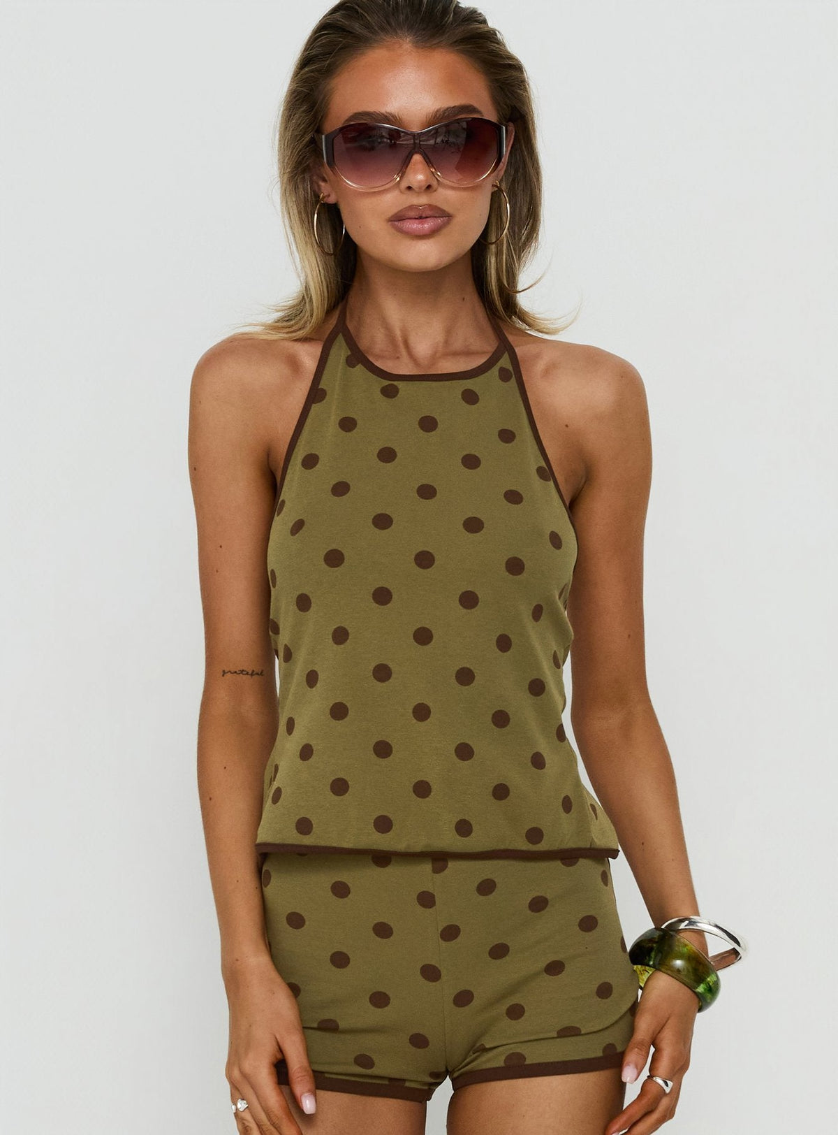 Speranza High-Neck-Neckholder-Top mit grünen Polka Dots