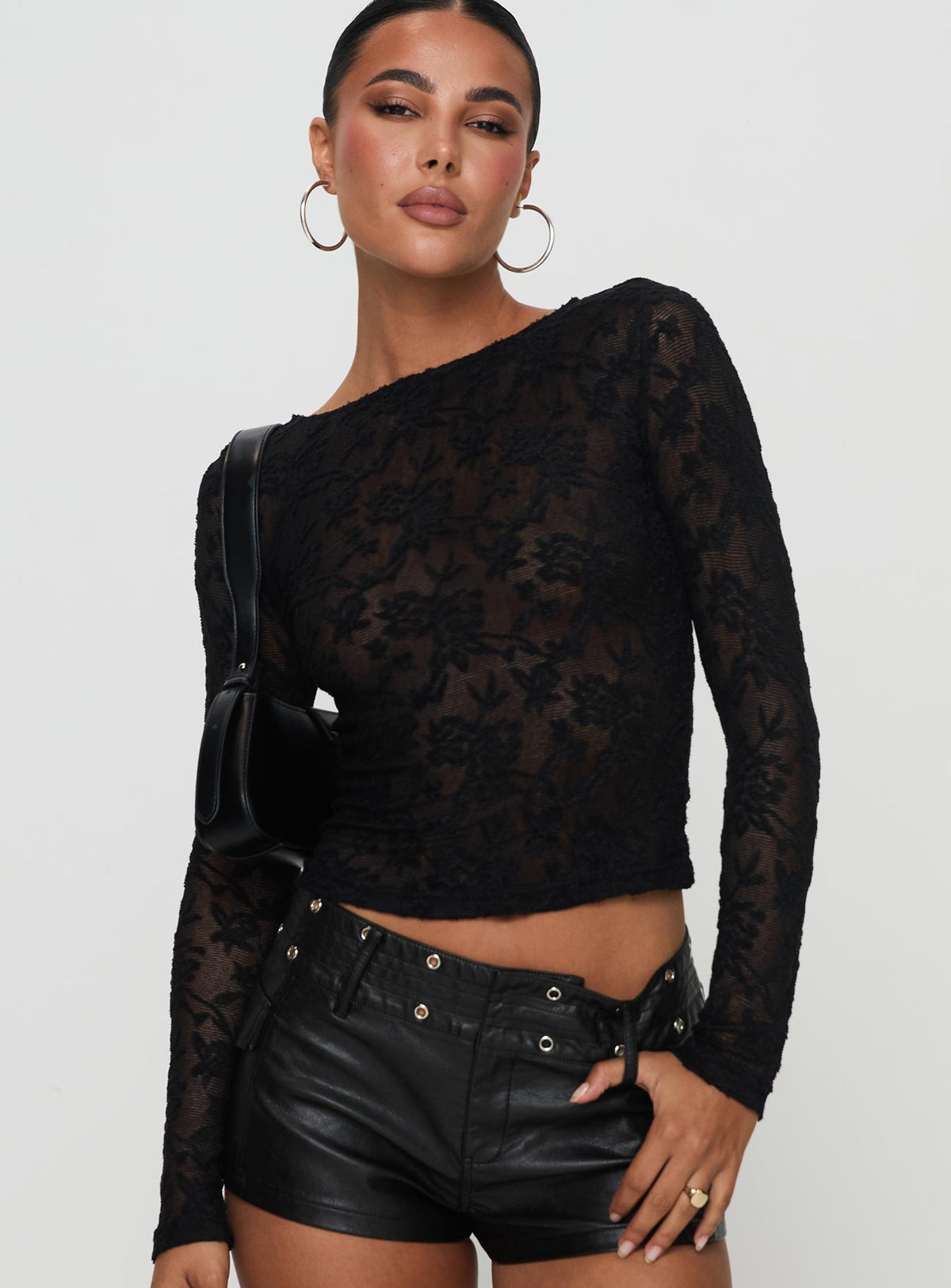 side view of model wearing Princess Polly Martine Sheer Top Black Full Sleeves High Neck 