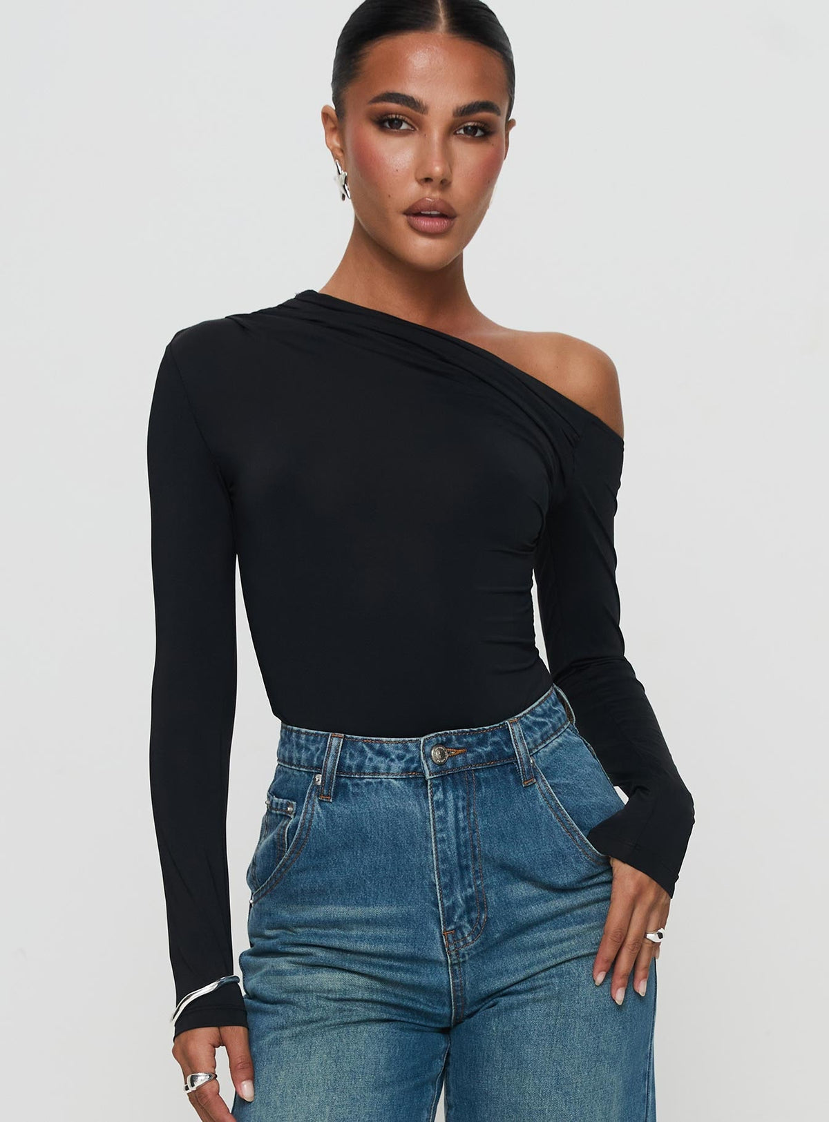 front view of model wearing Princess Polly Antilles One Shoulder Bodysuit Black Long Sleeve Tops Bodysuit 