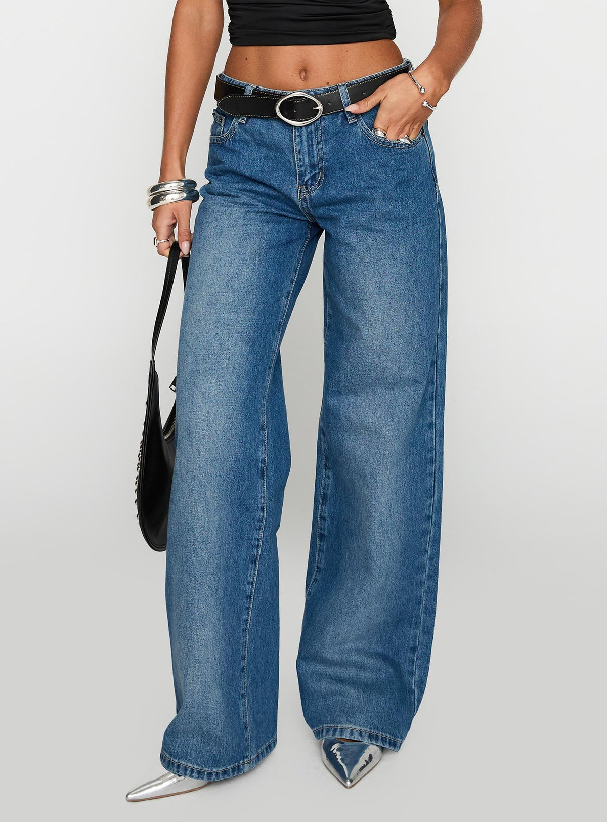 side view of model wearing Princess Polly On Sunset Mid Rise Straight Leg Jeans Dark Wash Mid Rise 