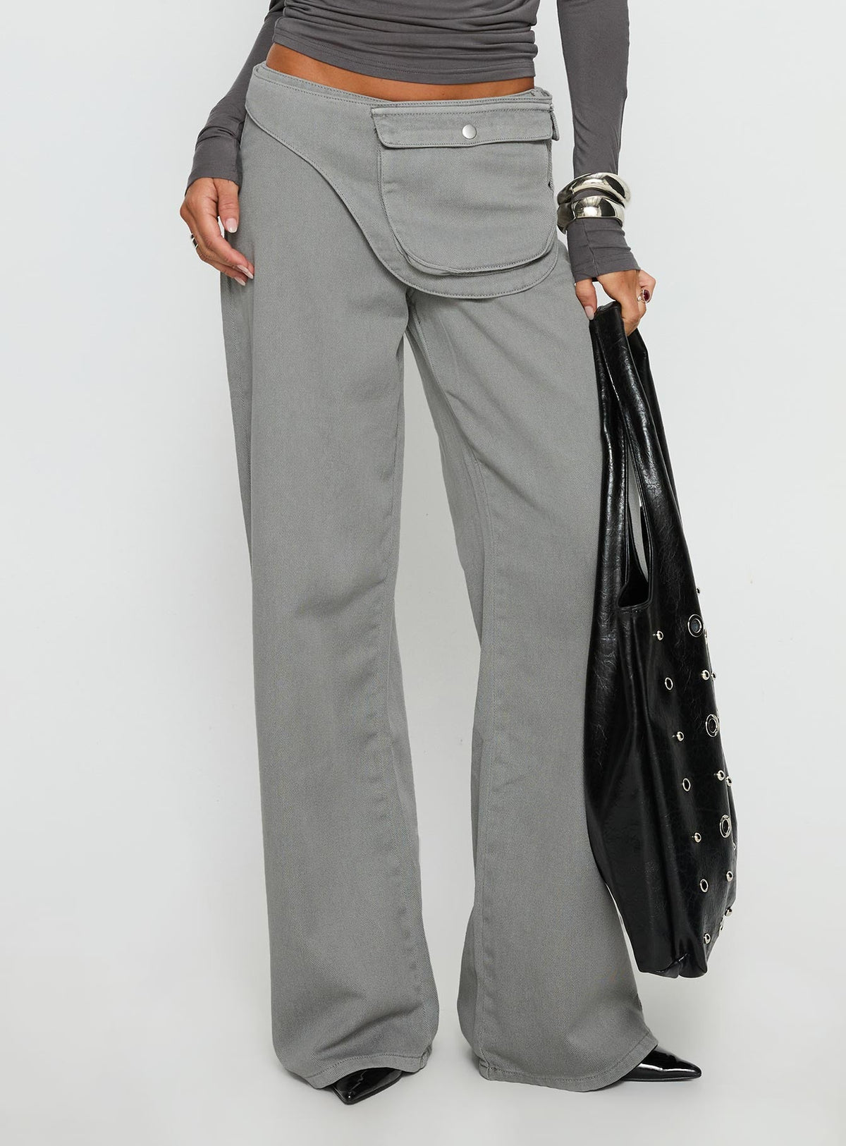 side view of model wearing Princess Polly Incognito Low Rise Wide Leg Cargo Jeans Grey Low Rise Jeans 