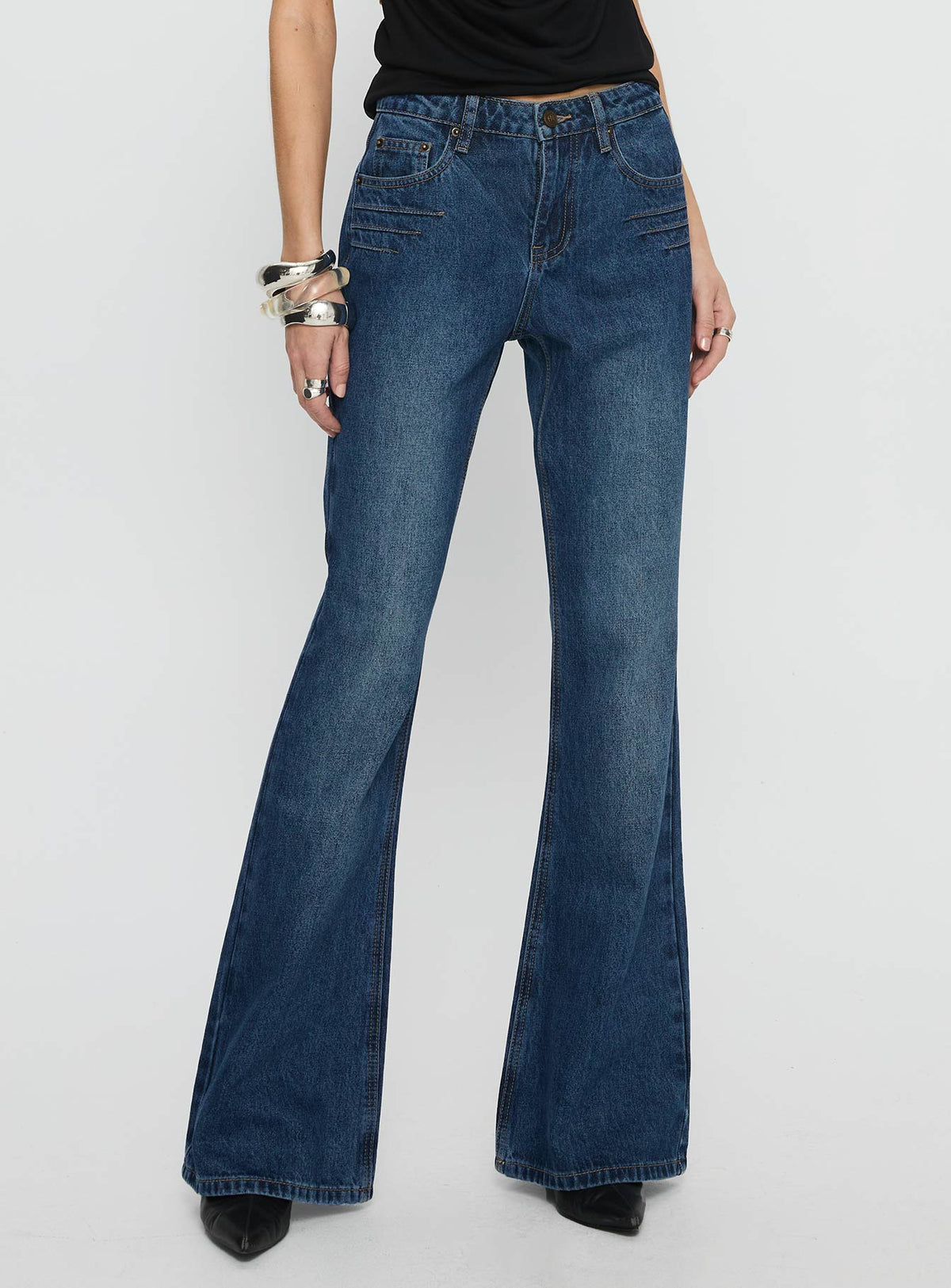 back view of model wearing Princess Polly Wide World Mid Rise Bootleg Jeans Mid Blue Mid Rise Jeans 