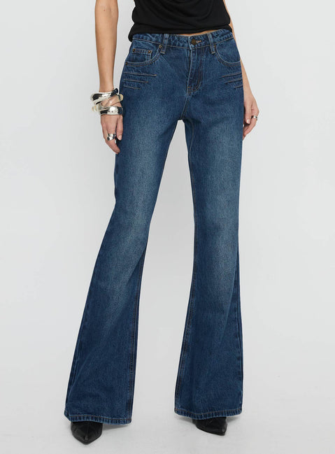 back view of model wearing Princess Polly Wide World Mid Rise Bootleg Jeans Mid Blue Mid Rise Jeans 