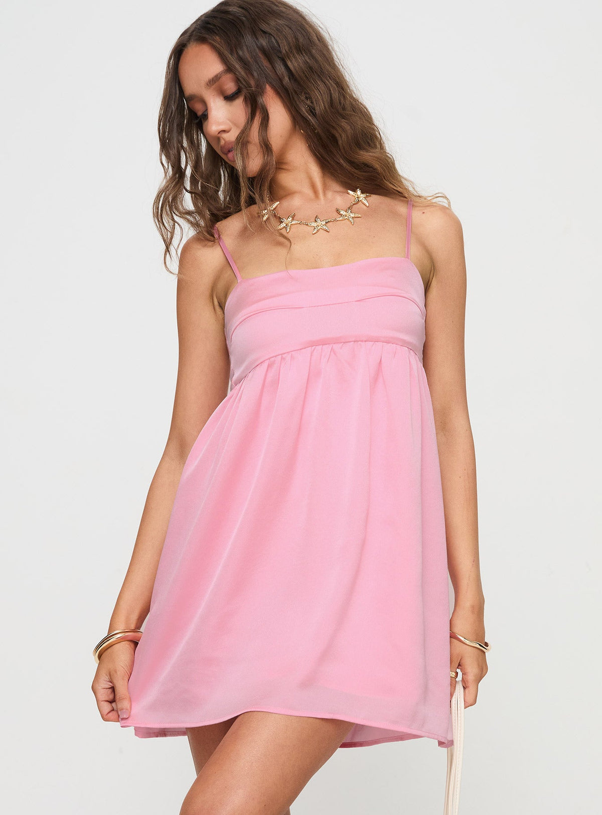 side view of model wearing Princess Polly Ortega Mini Dress Pink Square Neck 