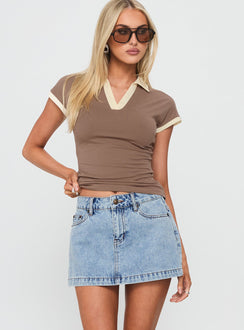   front view of model wearing Princess Polly Nicolina Low Rise Denim Mini Skirt Ice Blue Wash Mini Skirts 