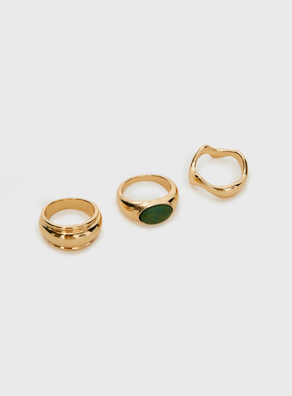 Three rings included, gold-toned, gem detail