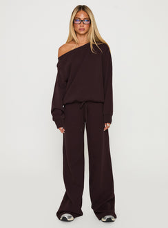 Showcasing the Wellness Off The Shoulder Jumper Brown in women's jumpers with long length and oversized fit front view of model wearing Princess Polly