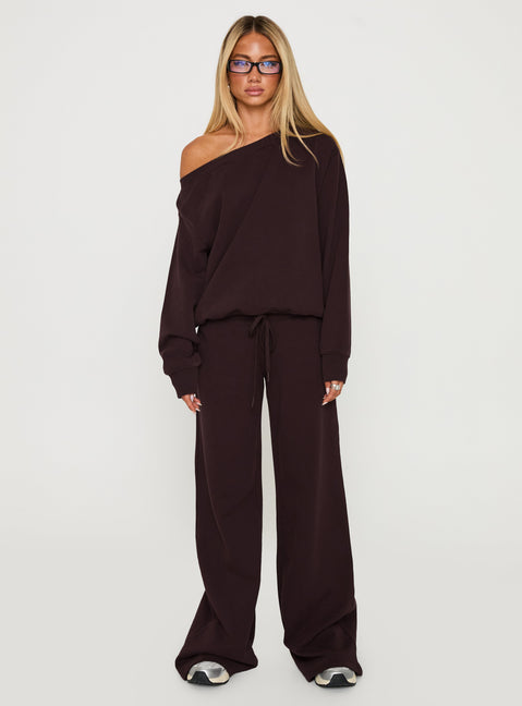Showcasing the Wellness Off The Shoulder Jumper Brown in women's jumpers with long length and oversized fit front view of model wearing Princess Polly