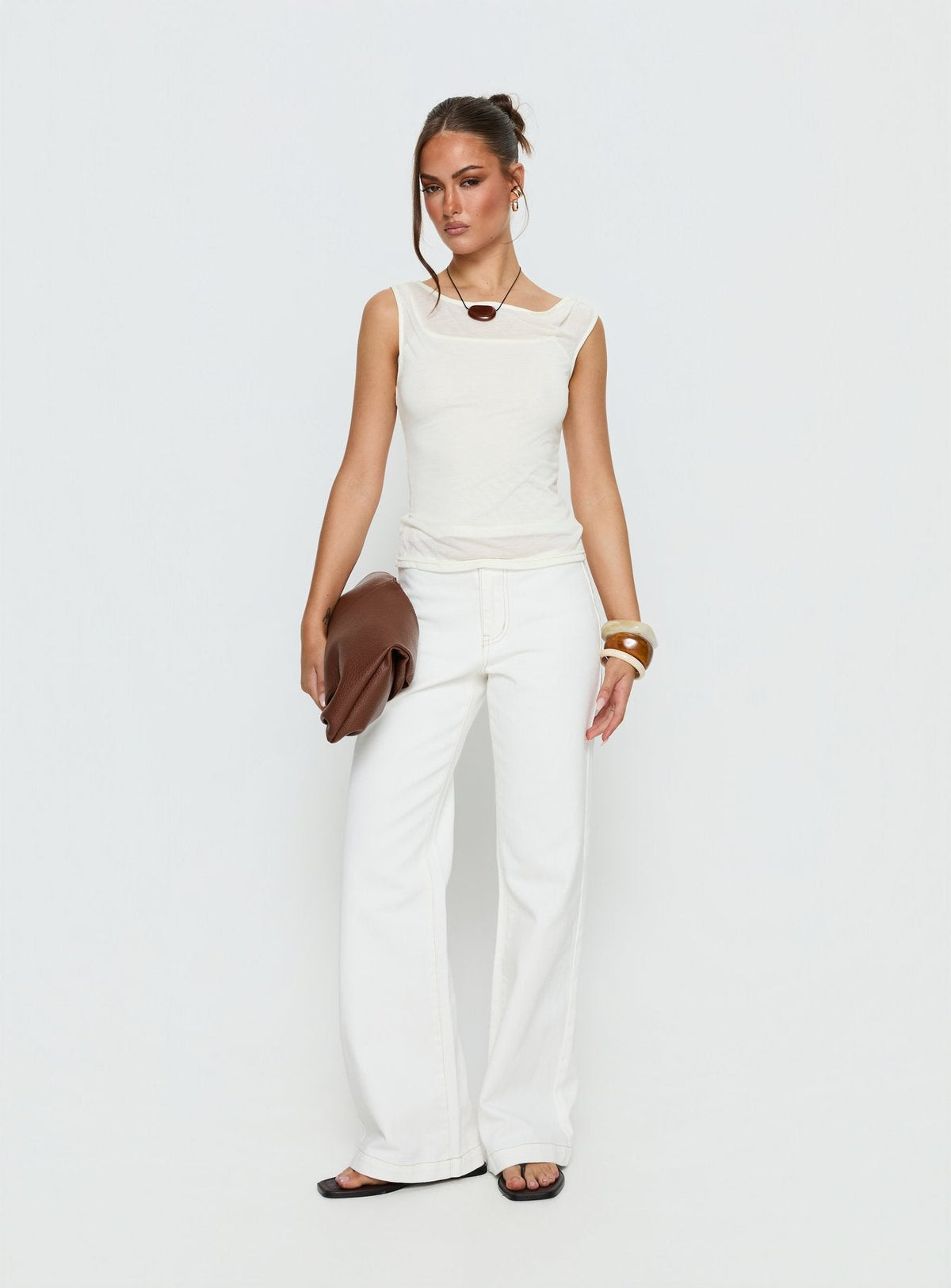 front view of model wearing Princess Polly Buenos No Waist Low Rise Straight Leg Jeans White Mid Rise Jeans 