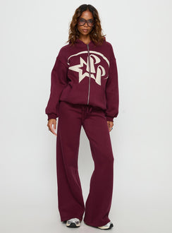 side view of model wearing Princess Polly Princess Polly Stargirl Zip Through Jumper Burgundy 