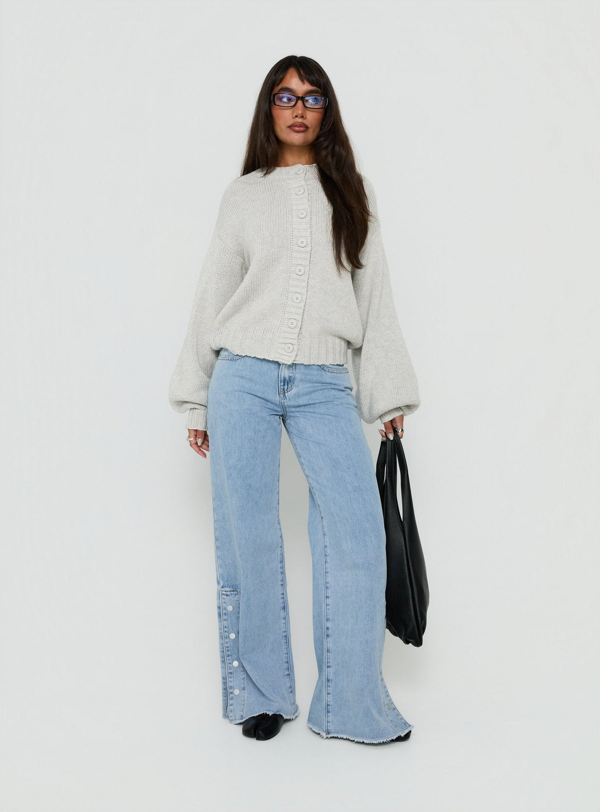 Showcasing the Edern Cardigan Light Grey Marle womens-jumpers in short oversized front view of model wearing