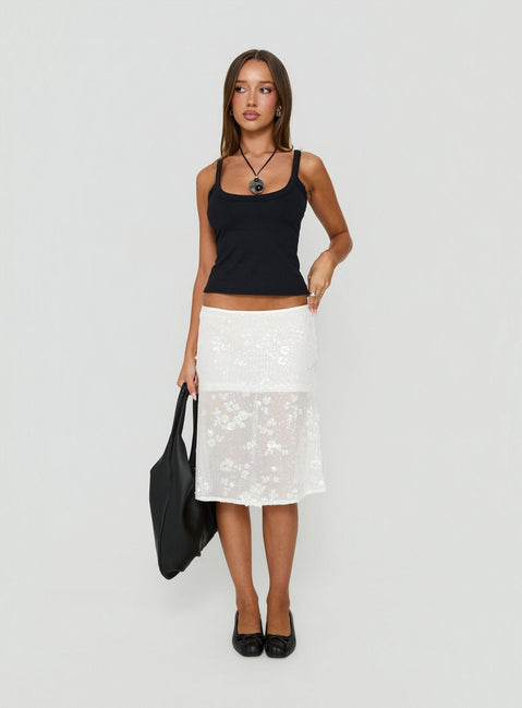 Showcasing the Heart Stealer Sheer Sequin Midi Skirt in White with fitted a-line shape and frayed hem front view of model wearing Princess Polly