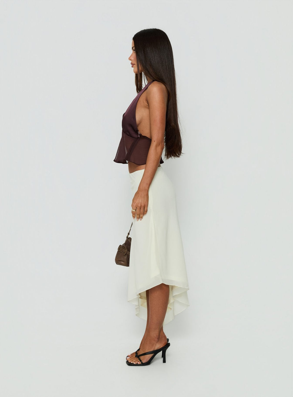 Designed with the Suella Asymmetrical Midi Skirt Off White in womens-skirts with a midi length side view of model wearing Princess Polly