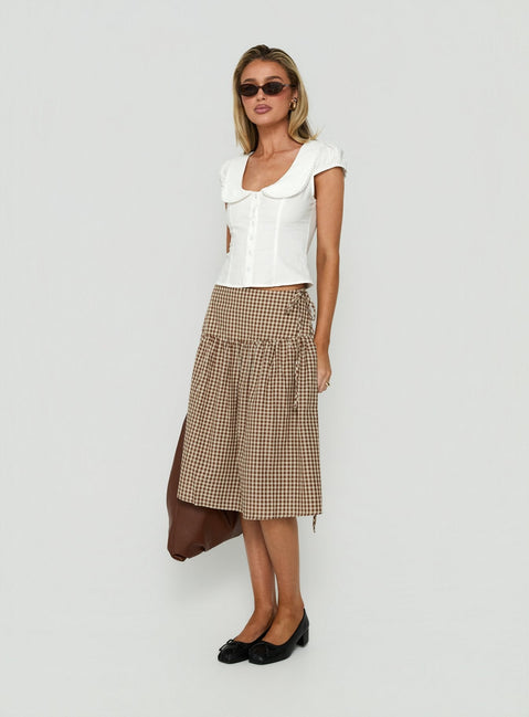 Crafted with the Kasida Tie Detail Midi Skirt Brown Check in womens-skirts with midi length detail view of model wearing Princess Polly