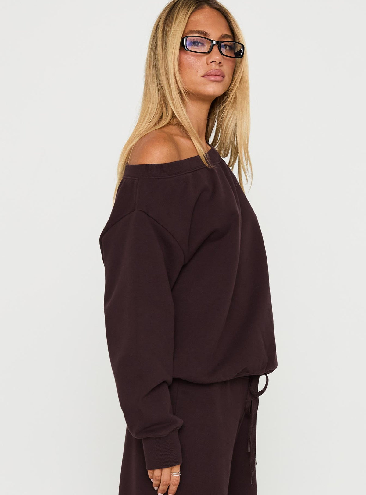 Designed with the Wellness Off The Shoulder Jumper Brown in women's jumpers featuring long length side view of model wearing Princess Polly