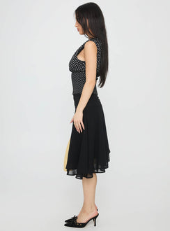   side view of model wearing Princess Polly Evanescence Asymmetrical Midi Skirt Black Midi Skirts 