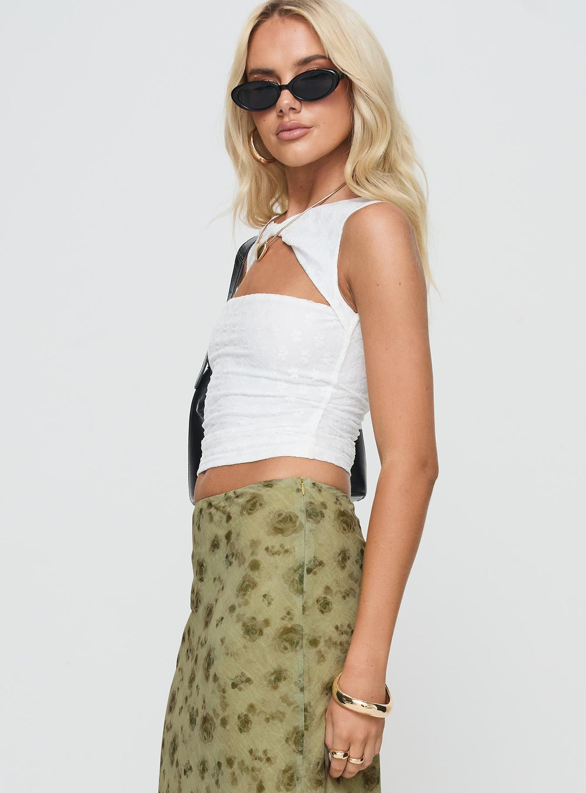 side view of model wearing Princess Polly Martiney Twisted Tank Top White Sleeveless Crew Neck 
