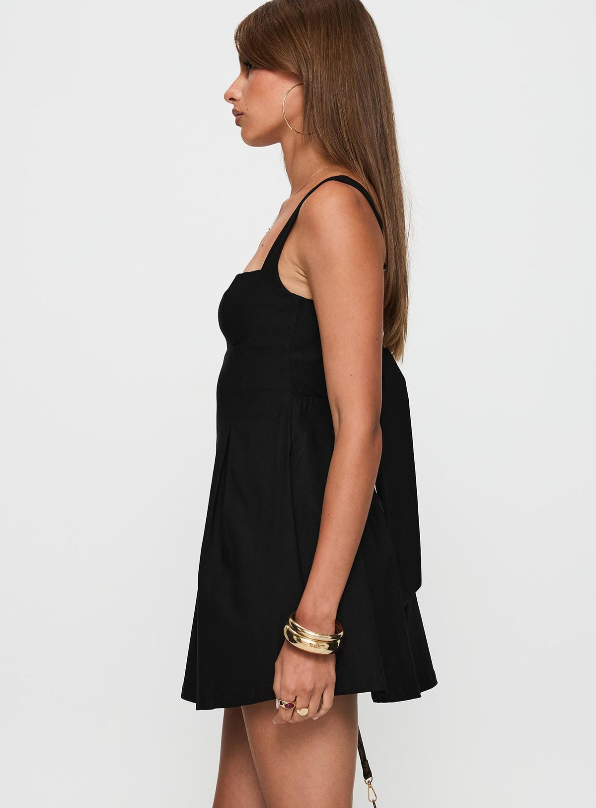 side view of model wearing Princess Polly Xanthus Mini Dress Black Square Neck 