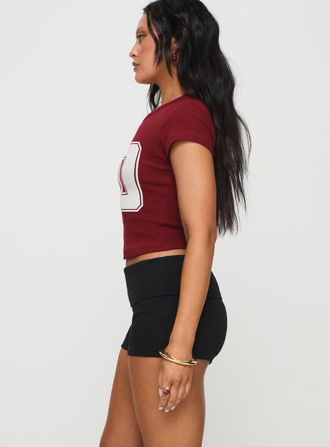 side view of model wearing Princess Polly Baseline Low Rise Rib Shorts Black High Waisted Shorts 