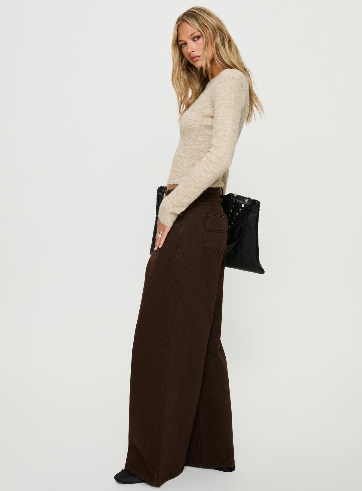 side view of model wearing Princess Polly Naylor Mid Rise Wide Leg Jeans Brown Mid Rise Jeans 
