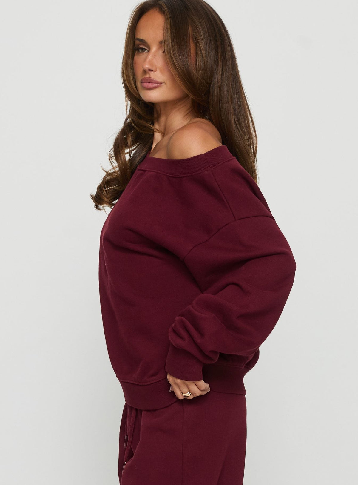 side view of model wearing Princess Polly Wellness Off the Shoulder Jumper Currant 