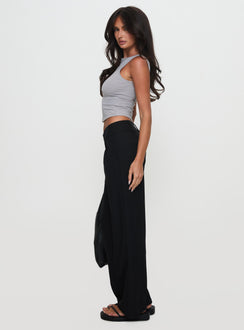 side view of model wearing Princess Polly Two Lovers Low Rise Pants Black Petite Low Rise Pants 