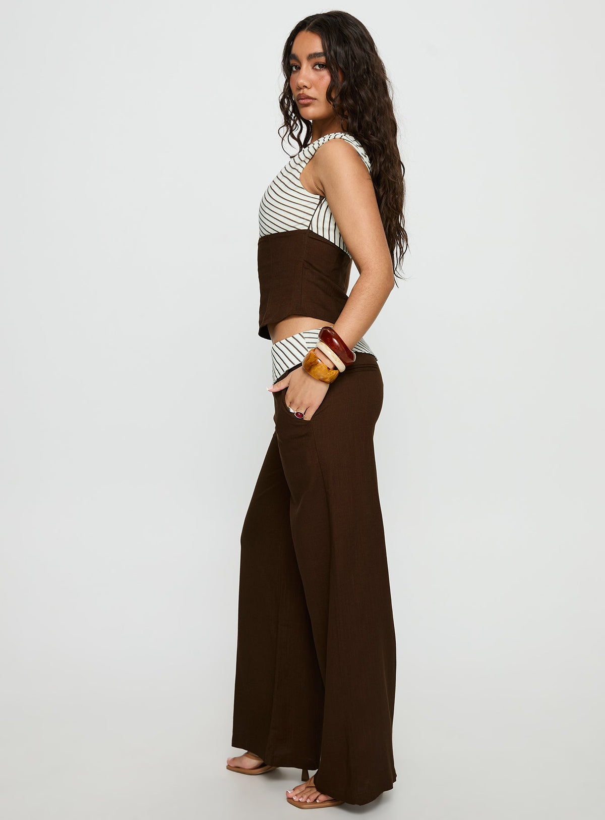 side view of model wearing Princess Polly Past Life Fold Over Waistband Pant Brown / Stripe Mid Rise Pants 