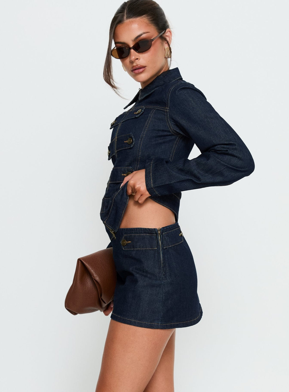   side view of model wearing Princess Polly Cristen Cadet Denim Mini Skirt Indigo Mini Skirts 