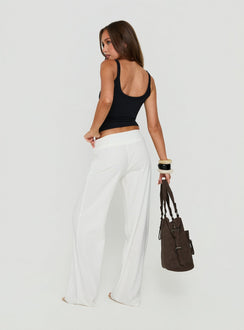 Highlighting the Brea Frill Belted Pants White womens-regular-pants with high-rise back view of model wearing