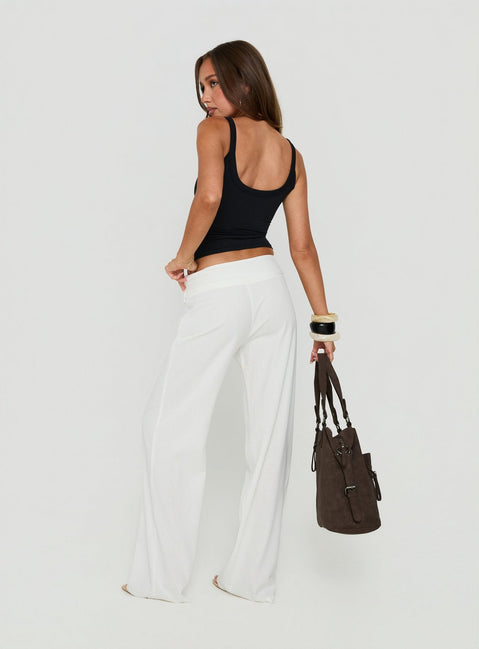 Highlighting the Brea Frill Belted Pants White womens-regular-pants with high-rise back view of model wearing