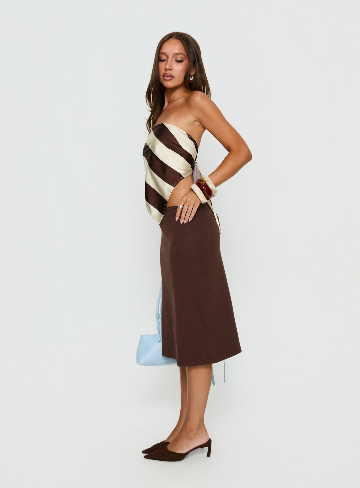   side view of model wearing Princess Polly Baseline Rib Midi Skirt Chocolate Midi Skirts Skirts 
