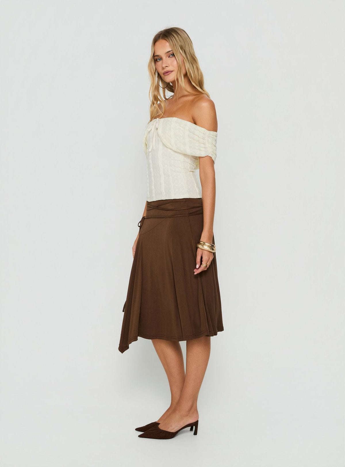 Showcasing the Joaney Tie Side Jersey Midi Skirt Chocolate womens-skirts in midi length side view of model wearing Princess Polly