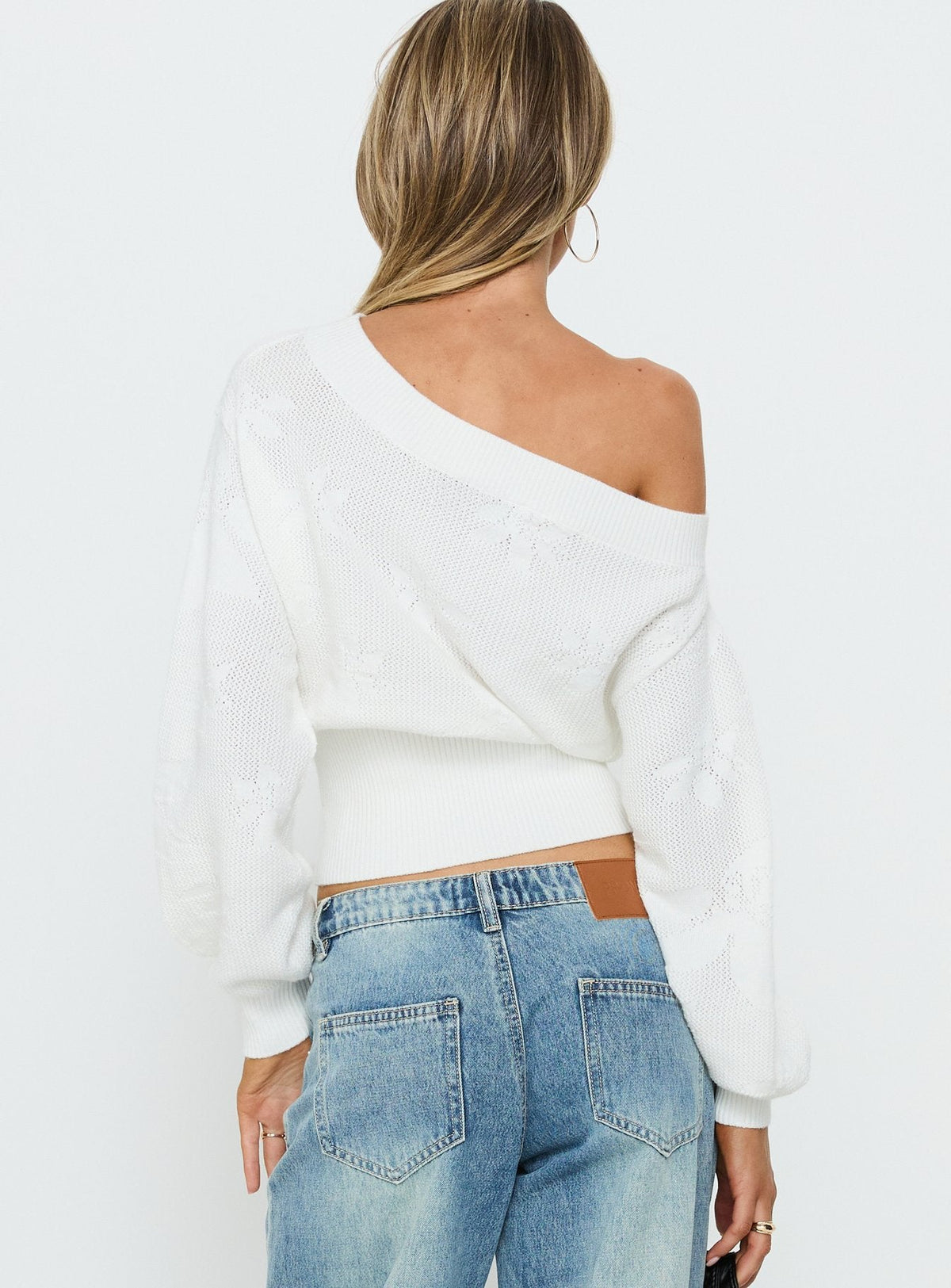 Crafted with Lalola Asymmetrical Knit Jumper White womens jumpers in short length back view of model wearing Princess Polly