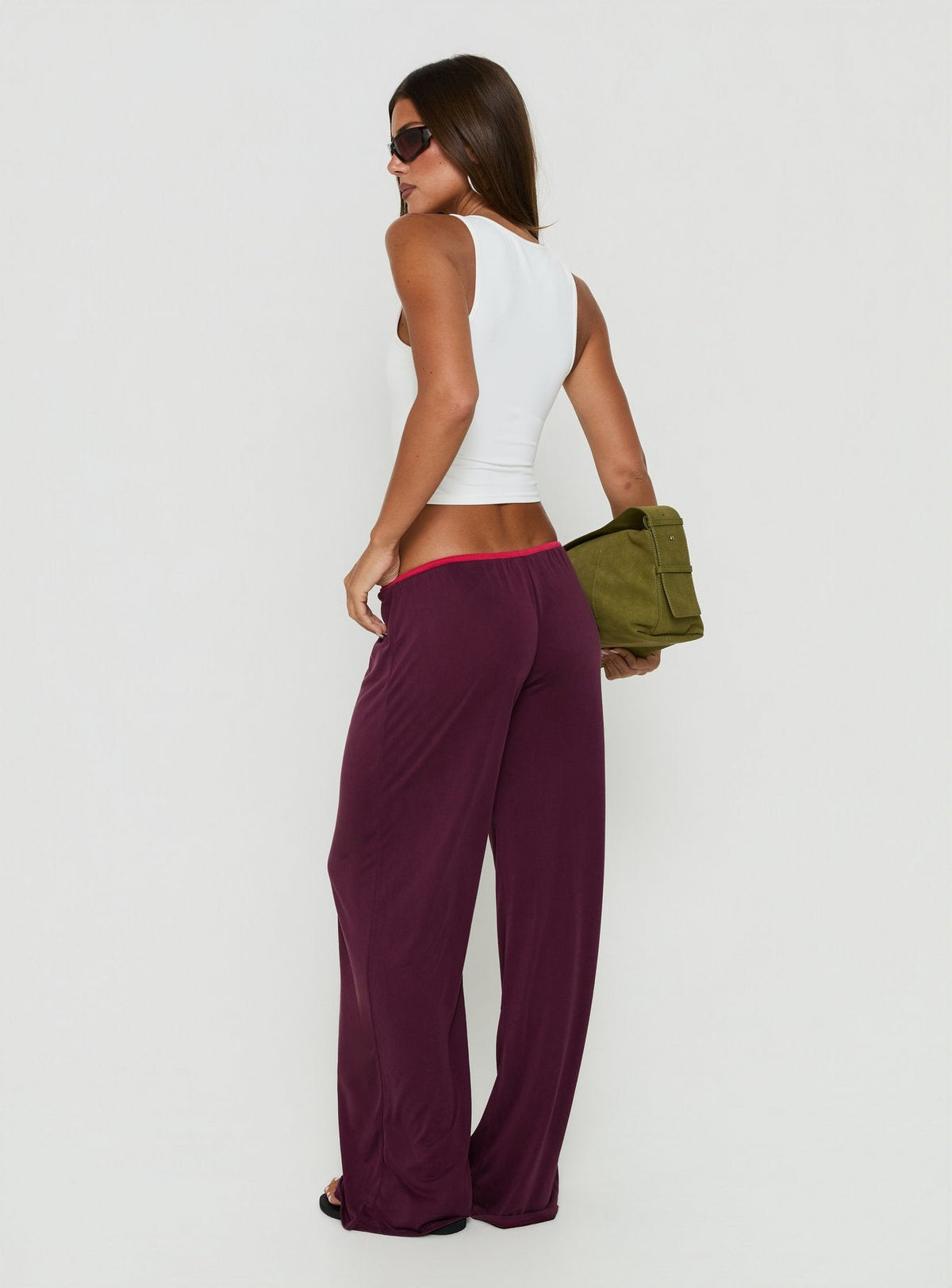 Presenting the Jessika Ultra Low Pants Red / Plum womens-regular-pants with low-rise fit back view of model wearing