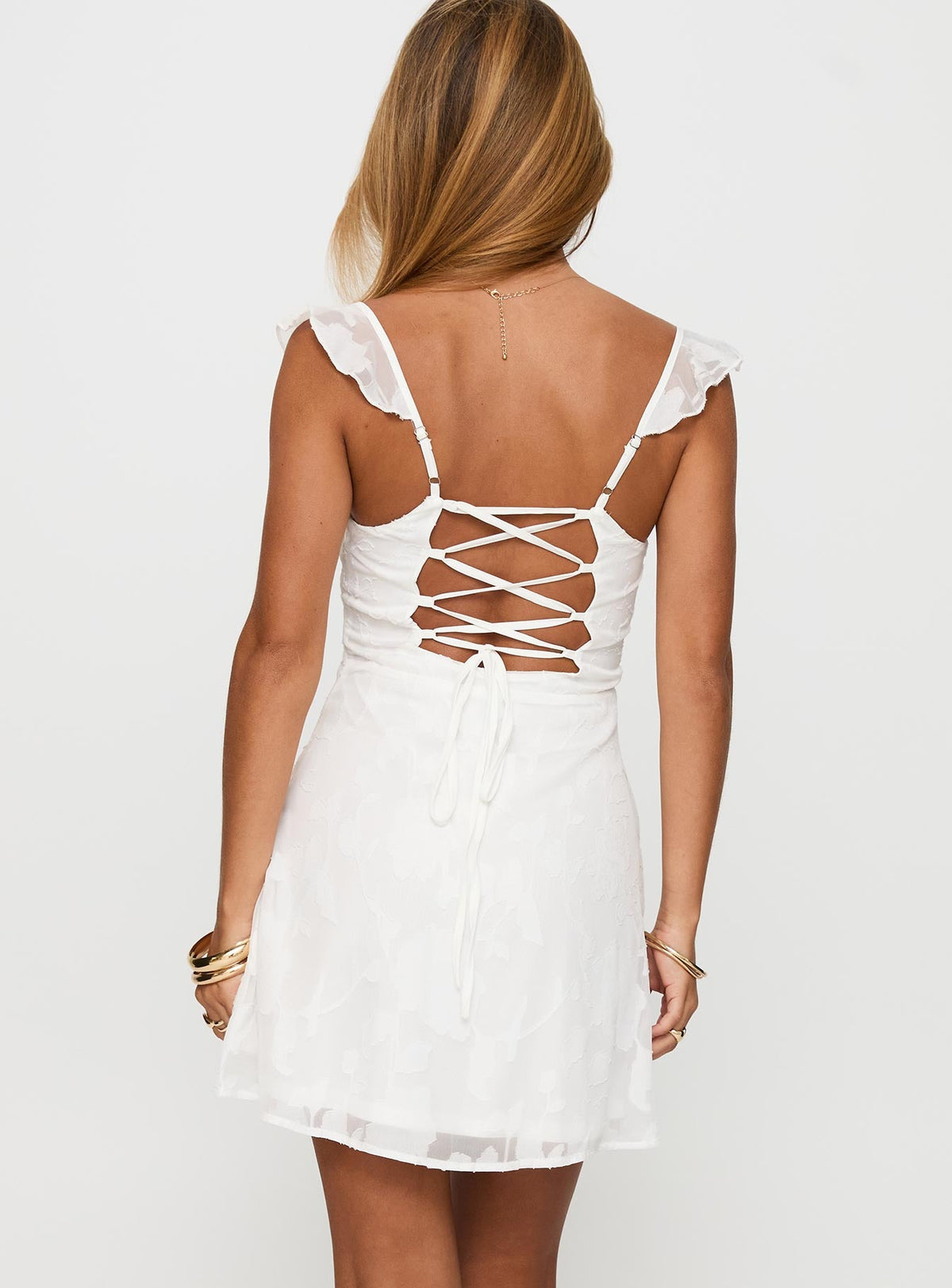 back view of model wearing Princess Polly Past And Present Burnout Tie Back Mini Dress White Sweetheart Neckline 