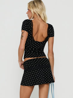Presenting the Amia Lace Mini Skirt Black Polka Dot womens-skirts mini length back view of model wearing Princess Polly