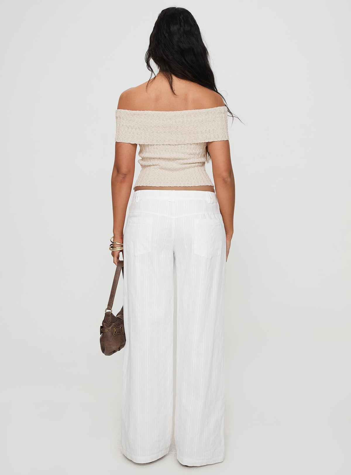 back view of model wearing Princess Polly Vendi Low Rise Pant White Low Rise Pants 