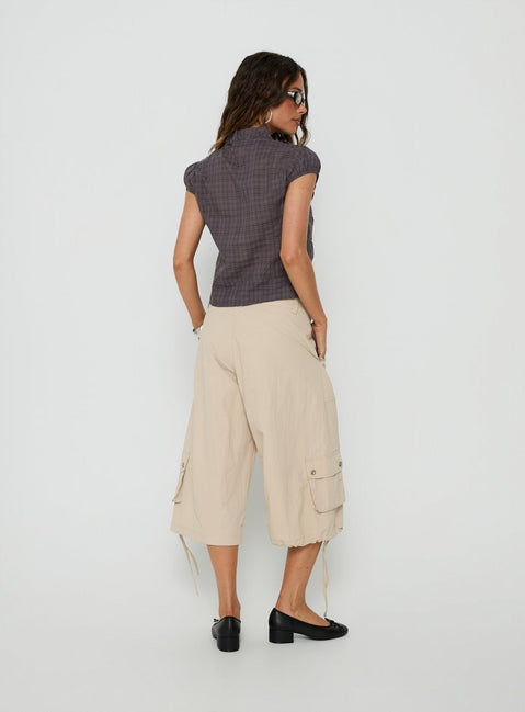Presenting the Relaxer 3/4 Cargo Pants Beige in womens regular pants with mid-rise back view of model wearing Princess Polly