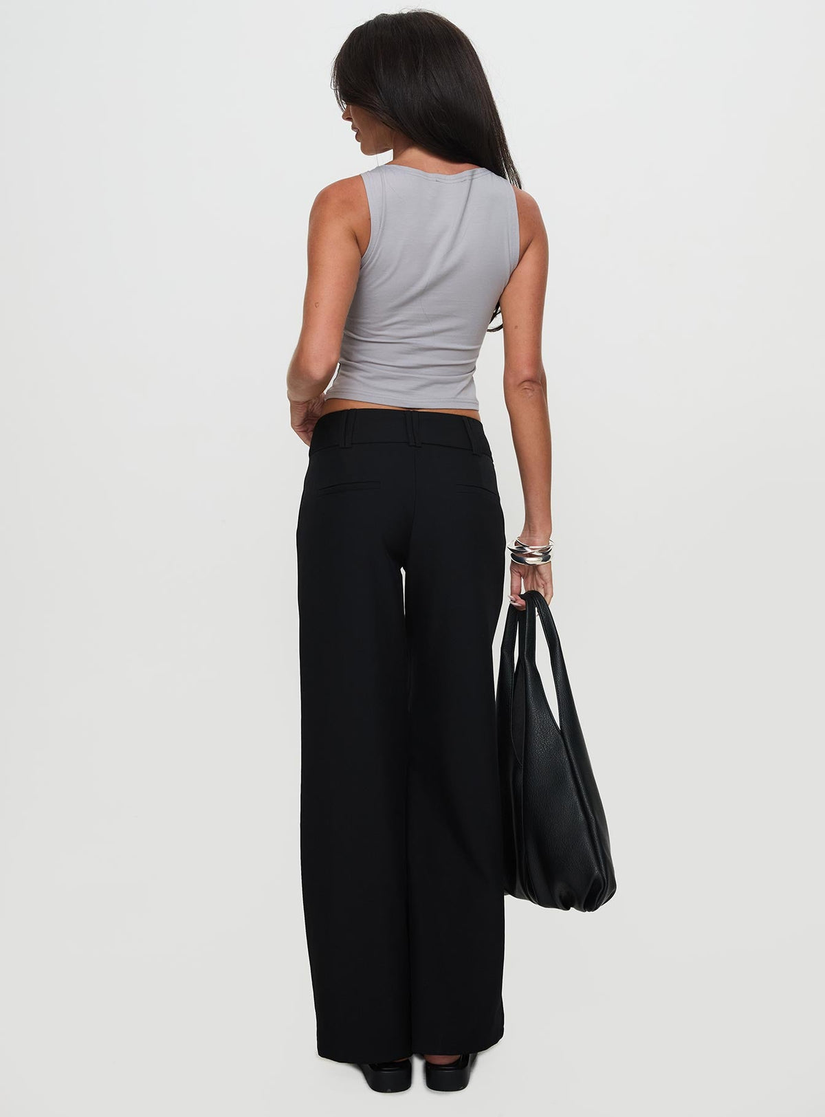 back view of model wearing Princess Polly Two Lovers Low Rise Pants Black Petite Low Rise Pants 