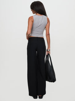 back view of model wearing Princess Polly Two Lovers Low Rise Pants Black Petite Low Rise Pants 