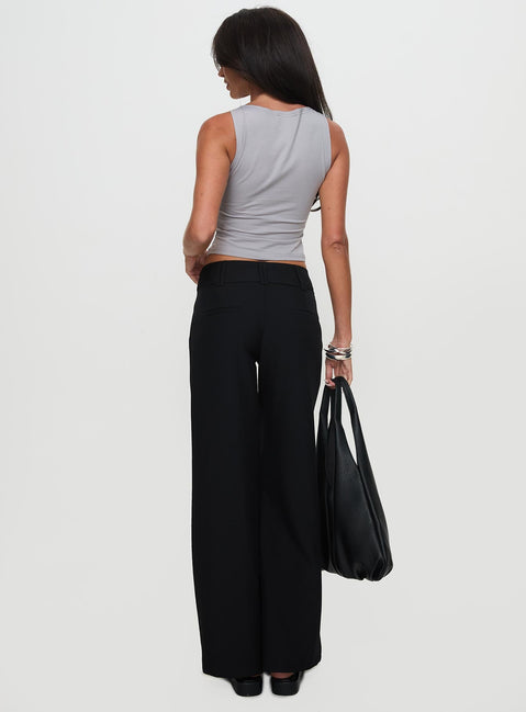 back view of model wearing Princess Polly Two Lovers Low Rise Pants Black Petite Low Rise Pants 