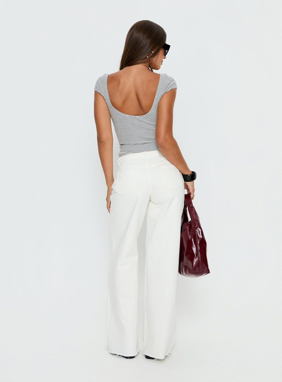 back view of model wearing Princess Polly Darla Low Rise Straight Leg Jean White Low Rise Jeans 